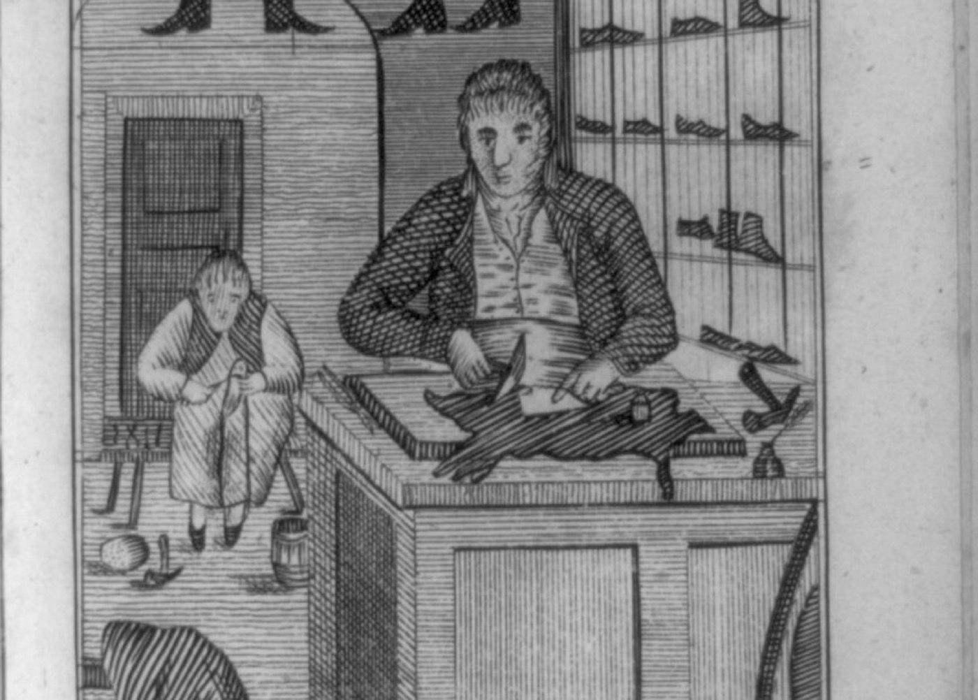An 1807 engraving of a shoemaker cutting leather at his board, with a boy apprentice stitching beside him